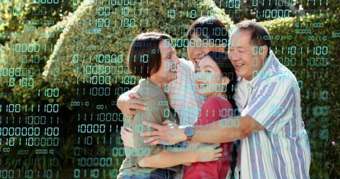 Multi-generational family hugging in sunlit backyard with teal binary code overlay