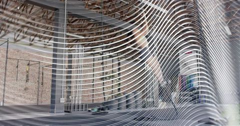Female athlete preparing to lift barbell at industrial gym rig with suspension straps