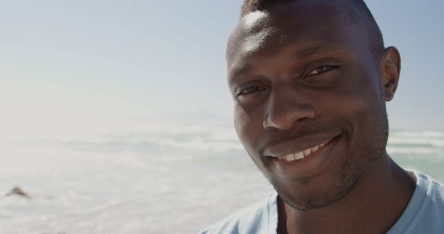 Smiling Young Man Enjoying Sunny Beach Day - Download Free Stock Images Pikwizard.com