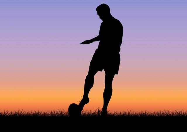 Silhouette male athlete playing rugby at dusk