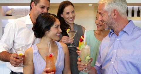 Group of Friends Enjoying Cocktails at a Bar - Download Free Stock Images Pikwizard.com