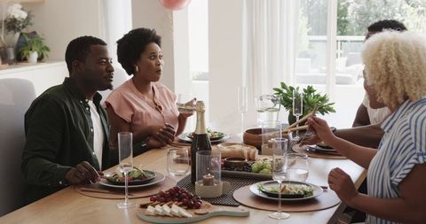 Friends Enjoying Lunch and Conversation at Home