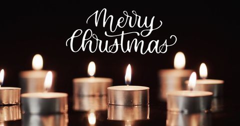 Merry Christmas Text with Lit Tea Candles on Black Background - Download Free Stock Images Pikwizard.com