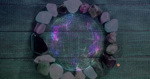 Digital Globe Surrounded by Colorful Stones on Wooden Background