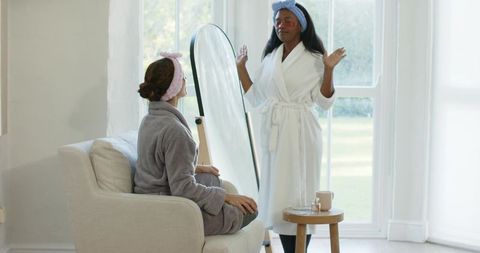 Diverse friends relaxing with beauty routine at home