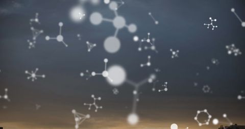 Molecular structures floating against cloudy sky