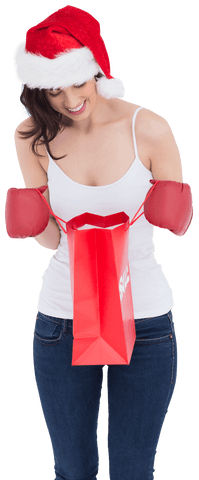 Smiling Woman in Santa Hat with Boxing Gloves and Red Shopping Bag