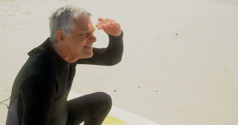 Senior Surfer Observing Ocean Beach Lifestyle - Download Free Stock Images Pikwizard.com