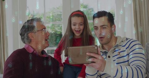 Multigenerational family sharing digital tablet moment on cozy living room sofa