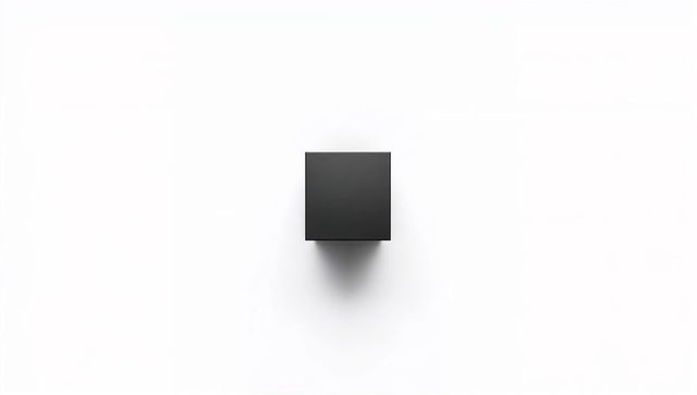 Matte black floating cube casting soft shadow on minimal white background