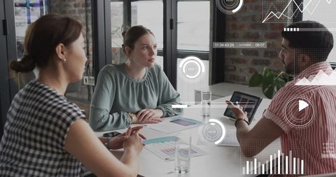 Business Team Collaborating Over Tablet with Digital Dashboards and Analytics HUD