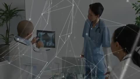 Medical Team Analyzing Digital Radiology Scan with Innovative Technology