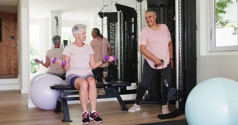 Multiracial senior couple enjoying home workout