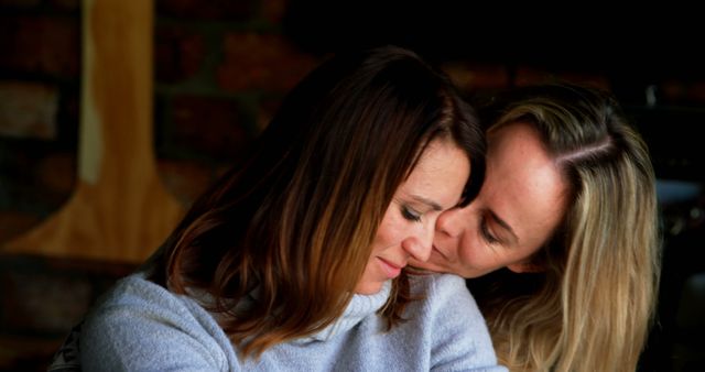 Smiling Women Enjoying Tender Moment Indoors - Download Free Stock Images Pikwizard.com