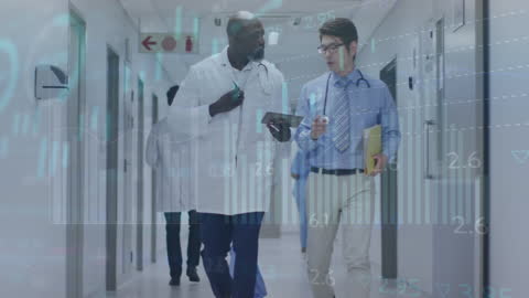 Diverse Doctors Analyzing Data in Modern Hospital Hallway