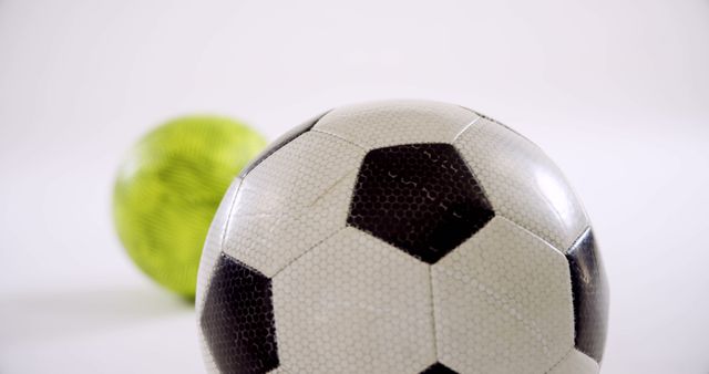 Close-up of Classic Soccer Ball and Modern Green Ball - Download Free Stock Images Pikwizard.com