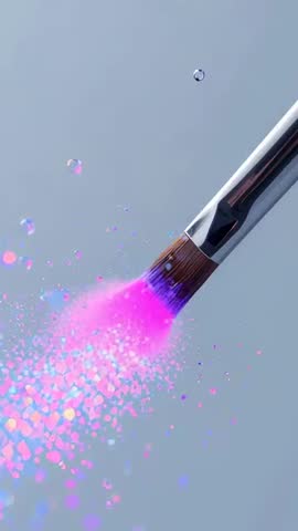 Vertical video: Makeup brush sweeping pink purple glitter exploding into sparkling mist
