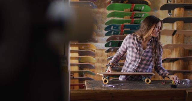 Young Woman Preparing Skateboard in Workshop - Download Free Stock Images Pikwizard.com