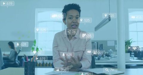 Professional Woman Discussing Social Media Engagement In Office Environment