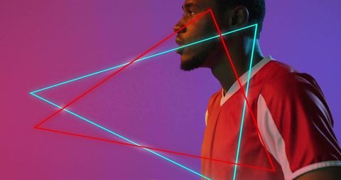 Right-facing man wearing red jersey with neon cyan and red geometric triangle lights