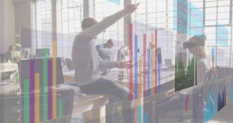 Collaborating team using vr and interactive data visualizations in modern office workspace