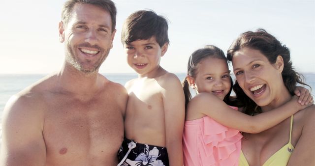 Happy Family Relaxing on Summer Beach - Download Free Stock Images Pikwizard.com