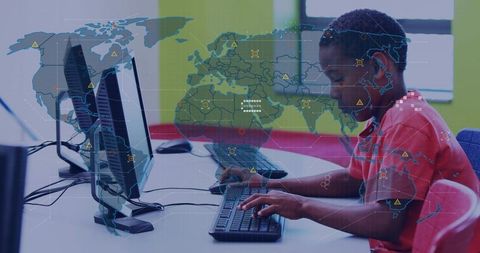 Student typing at computer lab with global cybersecurity world map and network overlay