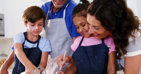 Family Enjoying Baking Together in Kitchen Setting