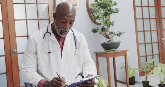 Doctor Writing Notes in Bright Office - Download Free Stock Images Pikwizard.com