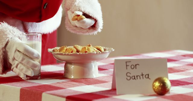 Santa Claus Enjoying Cookies and Milk - Download Free Stock Images Pikwizard.com