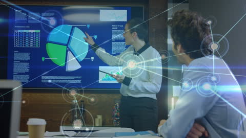 Diverse Businesspeople Analyzing Data During Digital Presentation