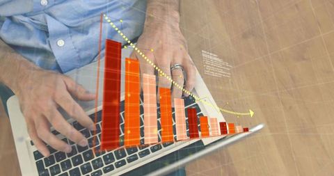 Hands typing on laptop with 3D declining sales bar chart overlay visualizing analytics and trends
