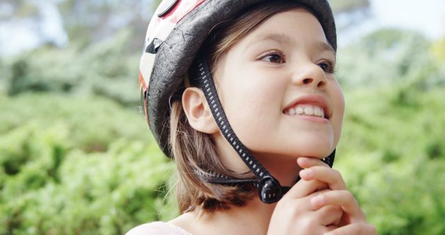 Young Girl Smiling with Bike Helmet in a Park - Download Free Stock Images Pikwizard.com