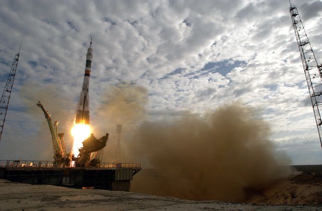 Destined for the International Space Station (ISS), a Soyez TMA-1 spacecraft launches from the Baikonur Cosmodrome, Kazakhstan on April 26, 2003. Aboard are Expedition Seven crew members, cosmonaut Yuri I. Malenchenko, Expedition Seven mission commander, and Astronaut Edward T. Lu, Expedition Seven NASA ISS science officer and flight engineer. Expedition Six crew members returned to Earth aboard the Russian spacecraft after a 5 and 1/2 month stay aboard the ISS. Photo credit: NASA/Scott Andrews