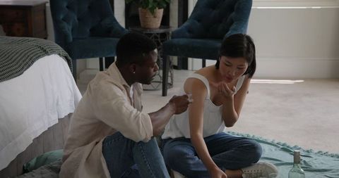 Diverse Friends Enjoying Leisure Time Together in Cozy Living Room