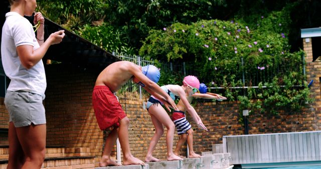 Children Diving into Pool during Summer Swim Practice with Coach - Download Free Stock Images Pikwizard.com