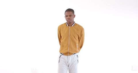 Confident Man Posing in Casual Wear Against White Background - Download Free Stock Images Pikwizard.com