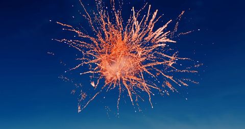 Vibrant Red Fireworks Against Clear Evening Sky - Download Free Stock Images Pikwizard.com