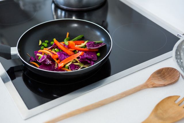 Food on a induction cooktop in kitchen at home
