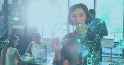 Digital Innovation: Professional Woman Coordinating Team in Connected Office