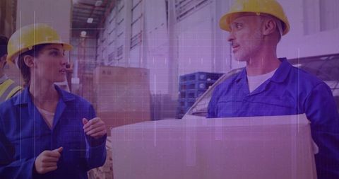 Teamwork in Warehouse with Workers Wearing Protective Gear