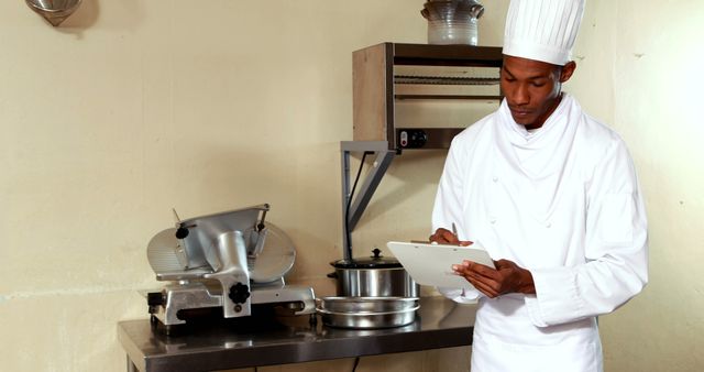 Professional Chef Inspecting Kitchen Equipment in Restaurant - Download Free Stock Images Pikwizard.com