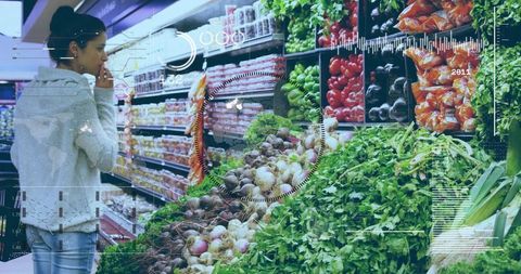 Woman selecting fresh produce with futuristic hud overlay in supermarket aisle