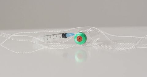 Medical syringe and vial entwined with fiber optic cable