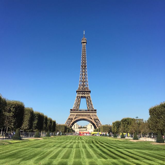 Eiffel Tower on a Clear Day with Manicured Lawn - Download Free Stock Photos Pikwizard.com