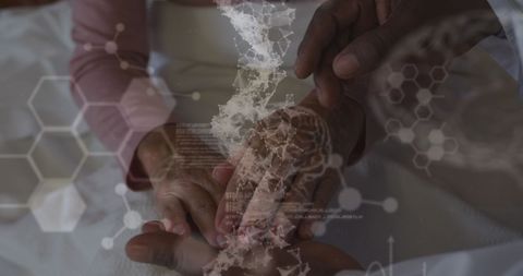 Medical insight with doctor holding senior female patient's hands