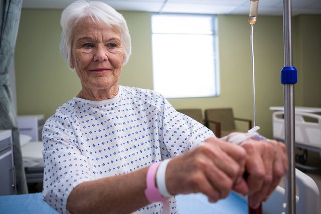 Smiling Senior Woman in Hospital Ward - Download Free Stock Photos Pikwizard.com