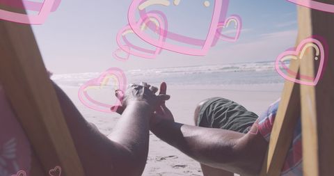Romantic Senior Couple Holding Hands on Beach