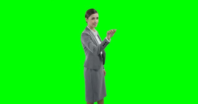 Businesswoman Pointing Against Green Screen Background - Download Free Stock Images Pikwizard.com