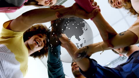 Diverse Team Collaborating with Digital World Graphic Overlay